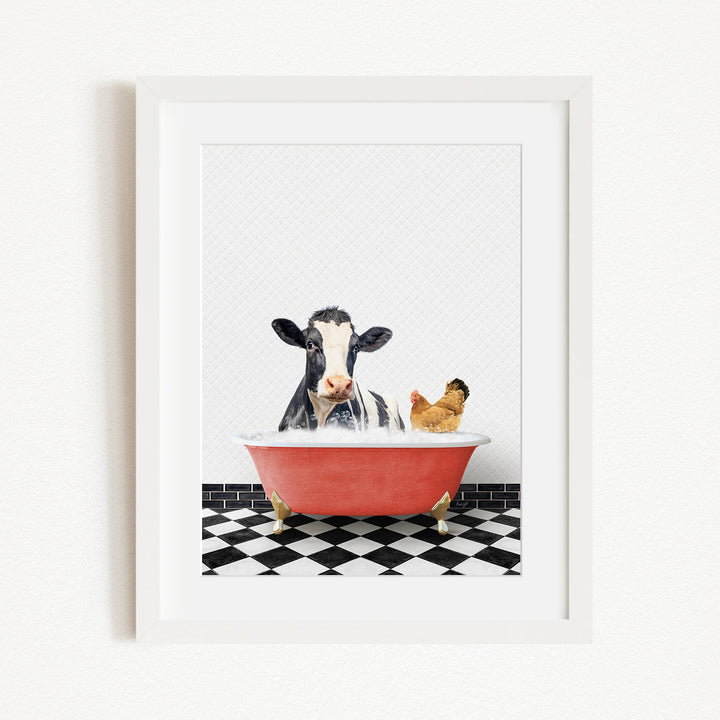 A black and white cow is sitting in a red bathtub, with a chicken standing nearby, in a black and white checkered floor.