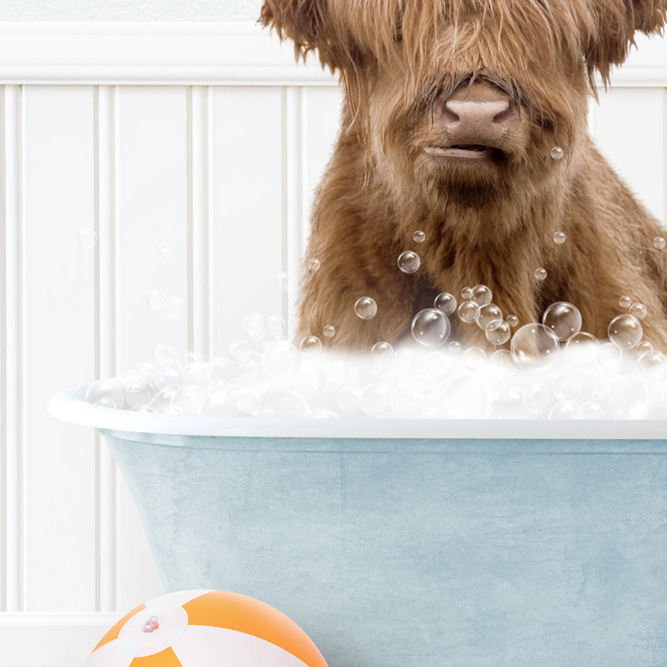 a brown dog sitting in a bath tub filled with bubbles