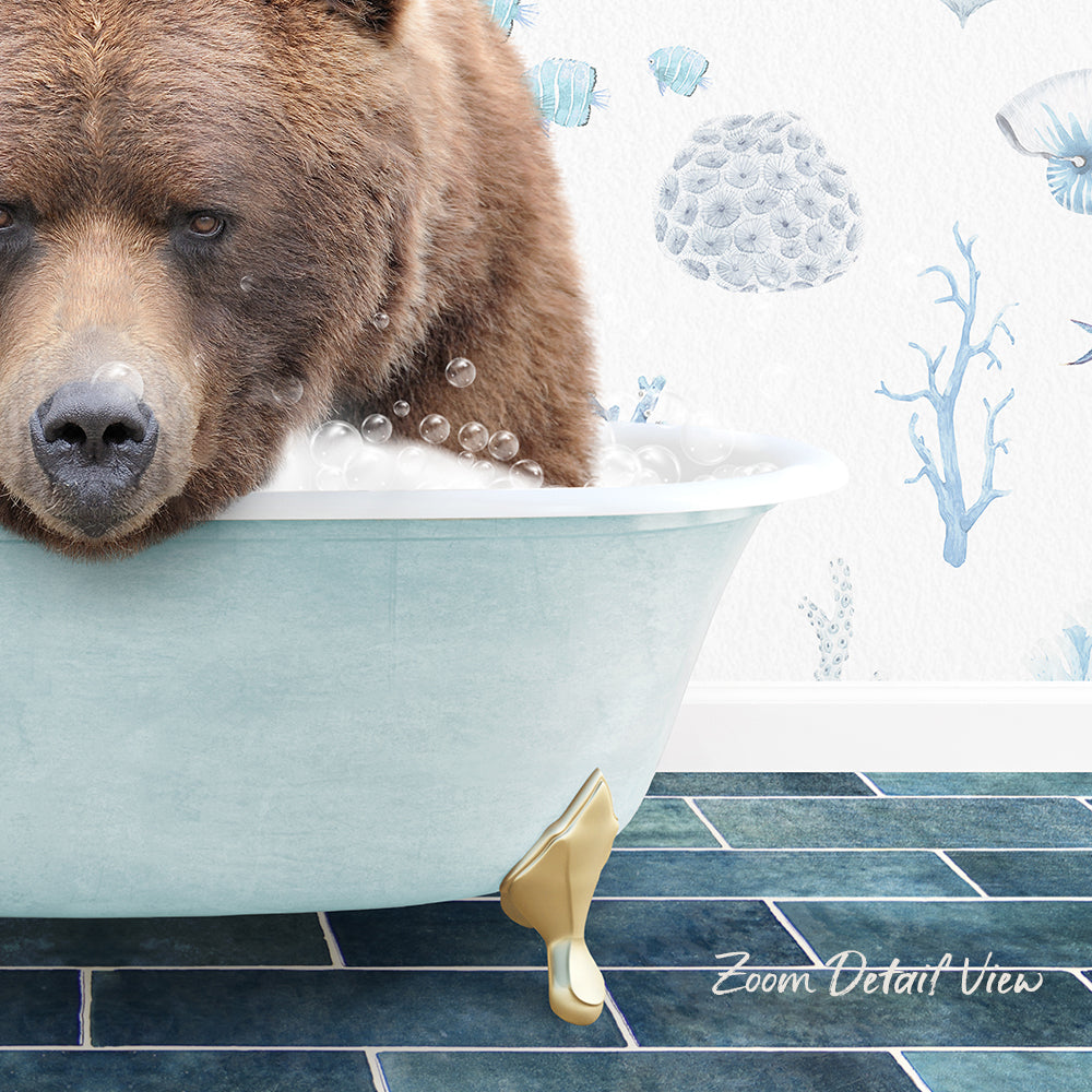 A large brown bear is sitting in a bathtub filled with bubbles, with a blue and white underwater scene wallpaper in the background.