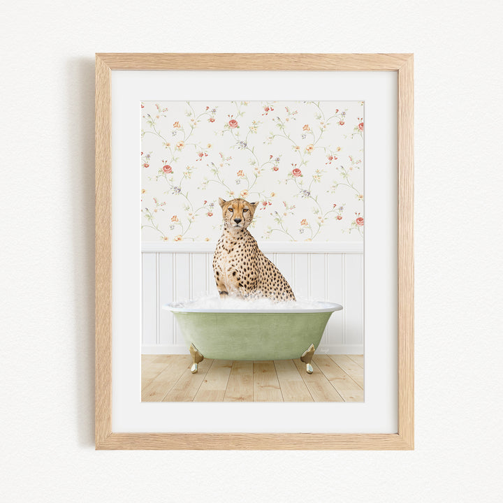 A cheetah sitting in a green bathtub filled with water, with a floral wallpaper in the background.