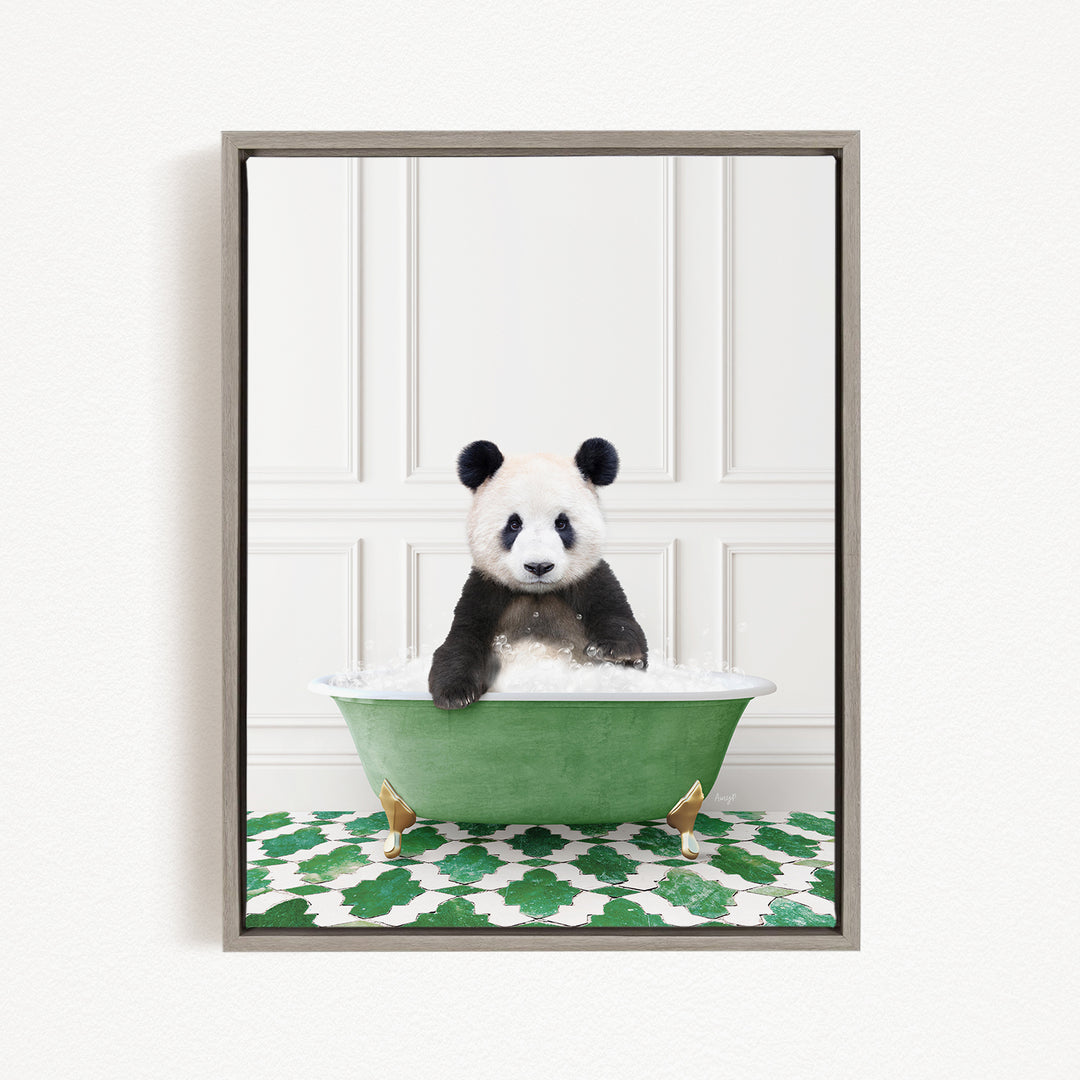 A panda bear sitting in a green bathtub filled with bubbles, surrounded by a green and white patterned mat.