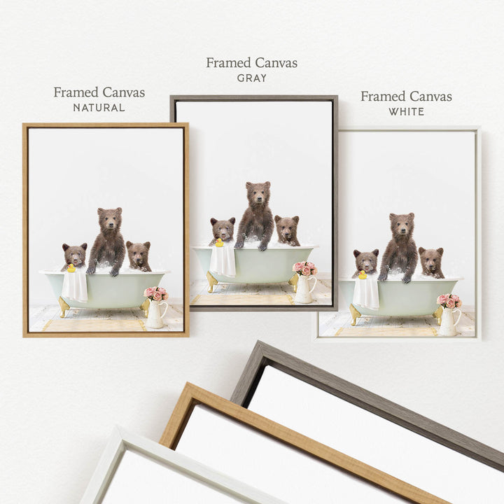three framed pictures of bears sitting in a bathtub, each with different colored frames.