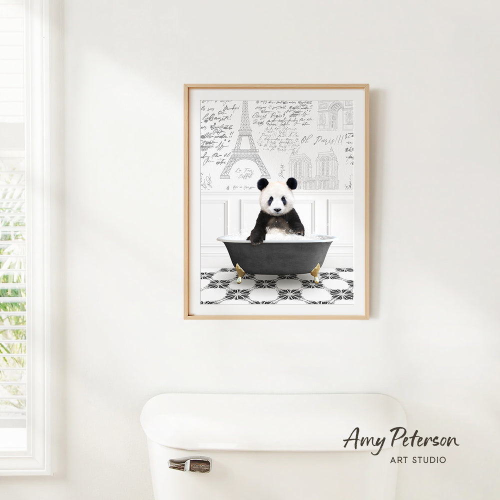 A framed image of a panda sitting in a bathtub, with the Eiffel Tower and other Parisian landmarks visible in the background.