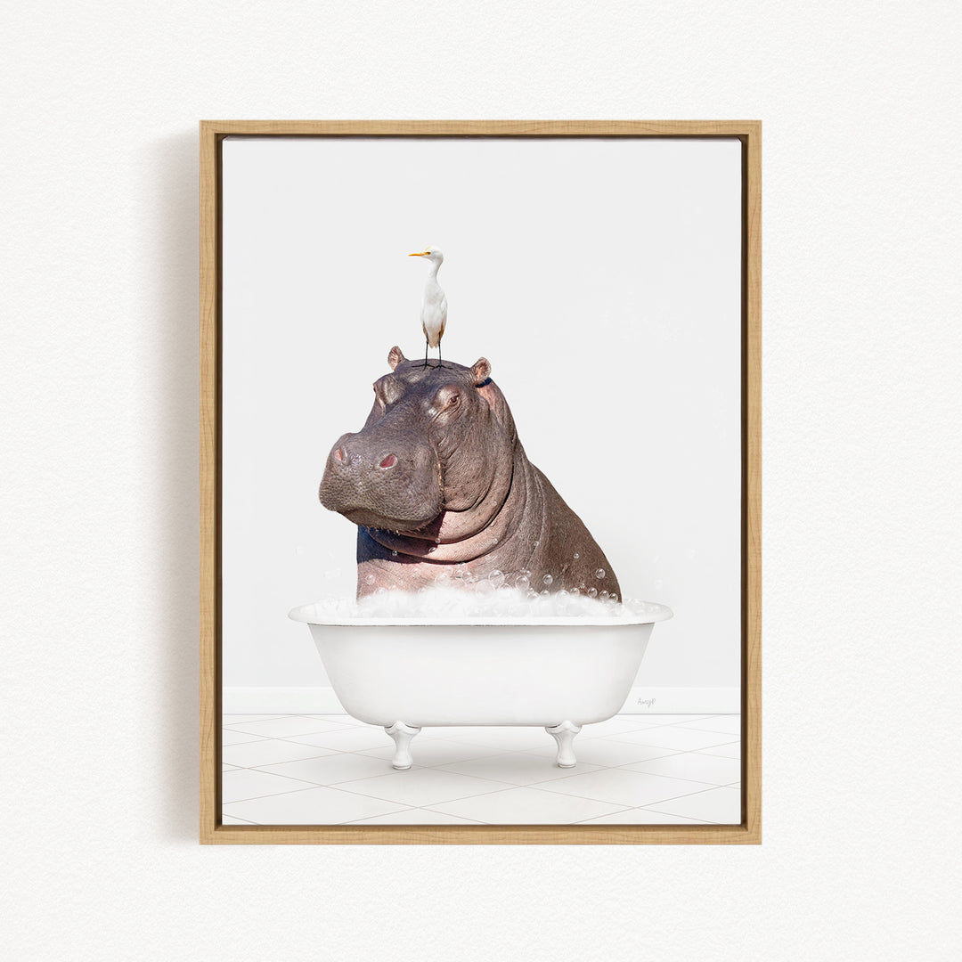 A large hippopotamus is sitting in a white bathtub, with a white bird perched on its head.