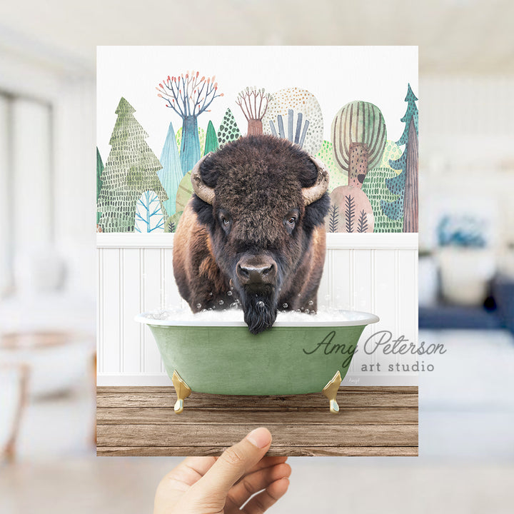 a person holding a card with a picture of a bison in a bathtub