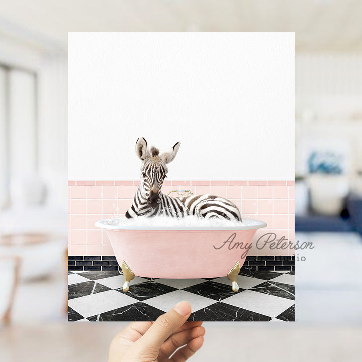 a person holding up a card with a zebra in a bathtub