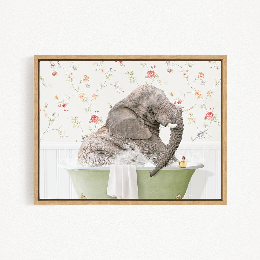A gray elephant is sitting in a green bathtub filled with water, surrounded by a floral patterned wall.