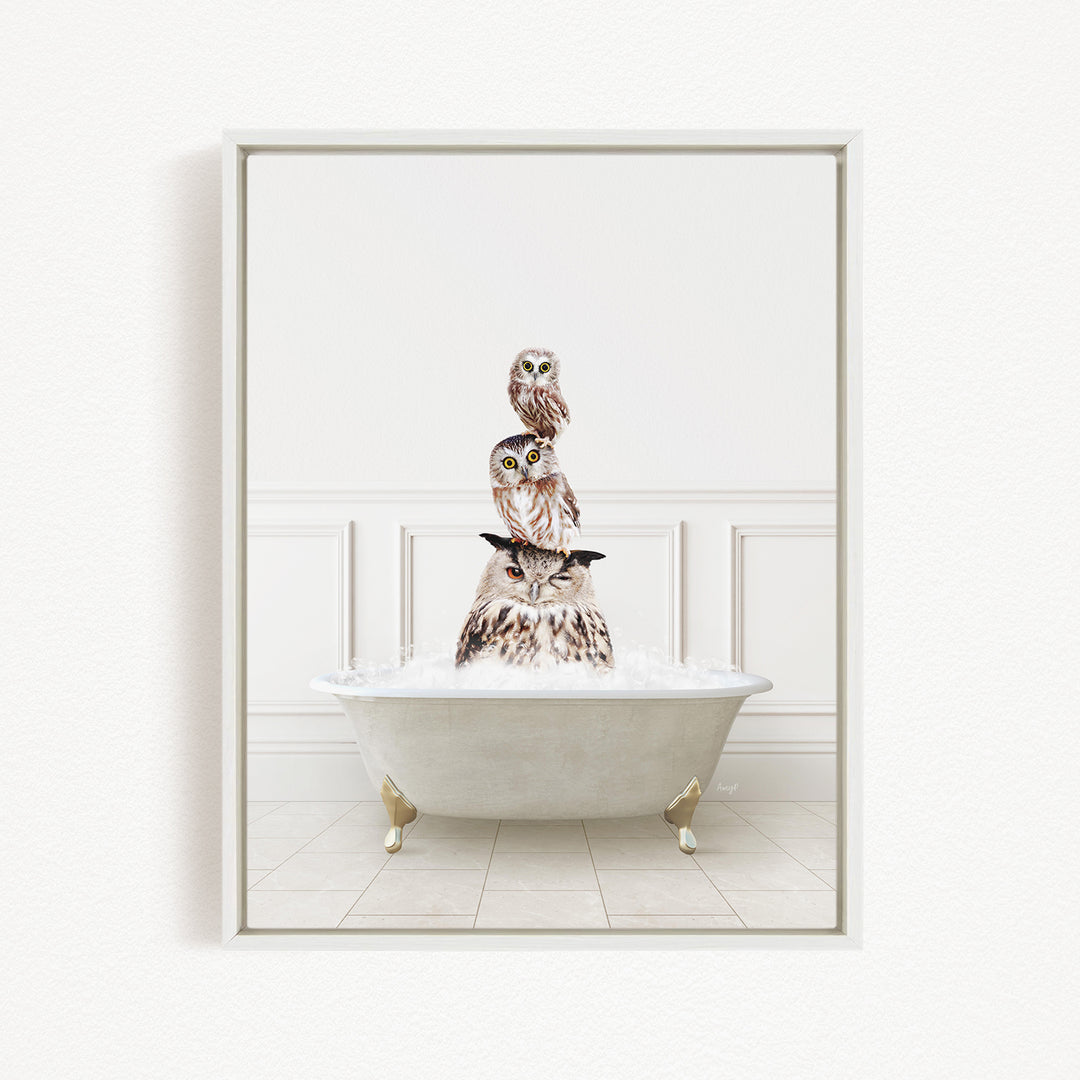 A white bathtub filled with water, with three owls sitting on top of it.