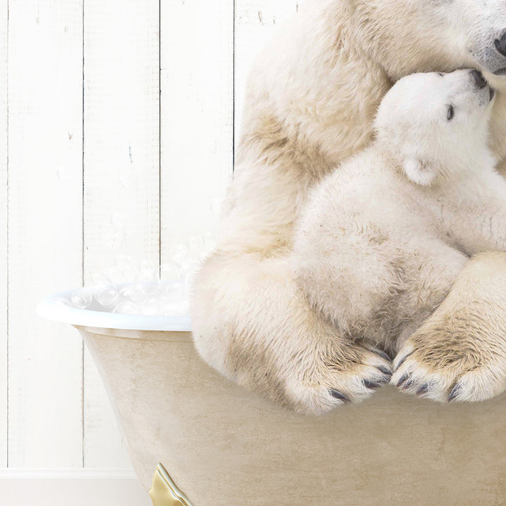 a mother polar bear cuddles her cub in a bathtub