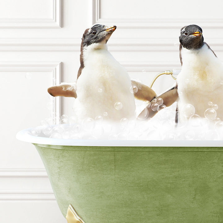 two penguins sitting in a bathtub with bubbles