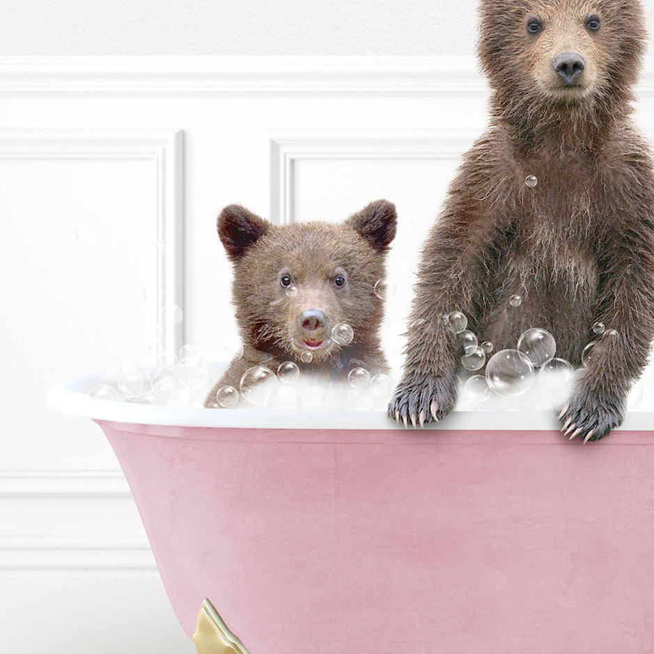 two brown bears are sitting in a bathtub