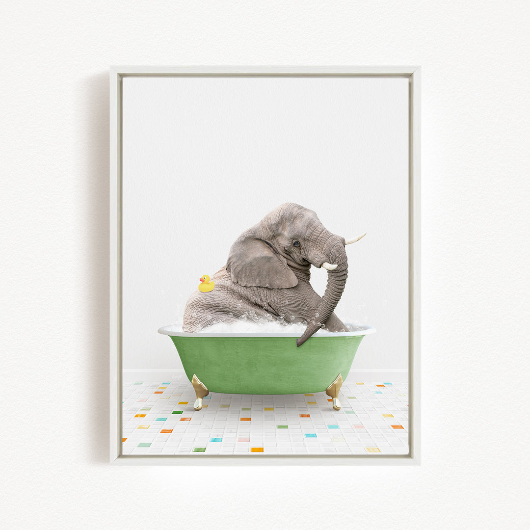 A gray elephant is sitting in a green bathtub, surrounded by colorful tiles on the floor.