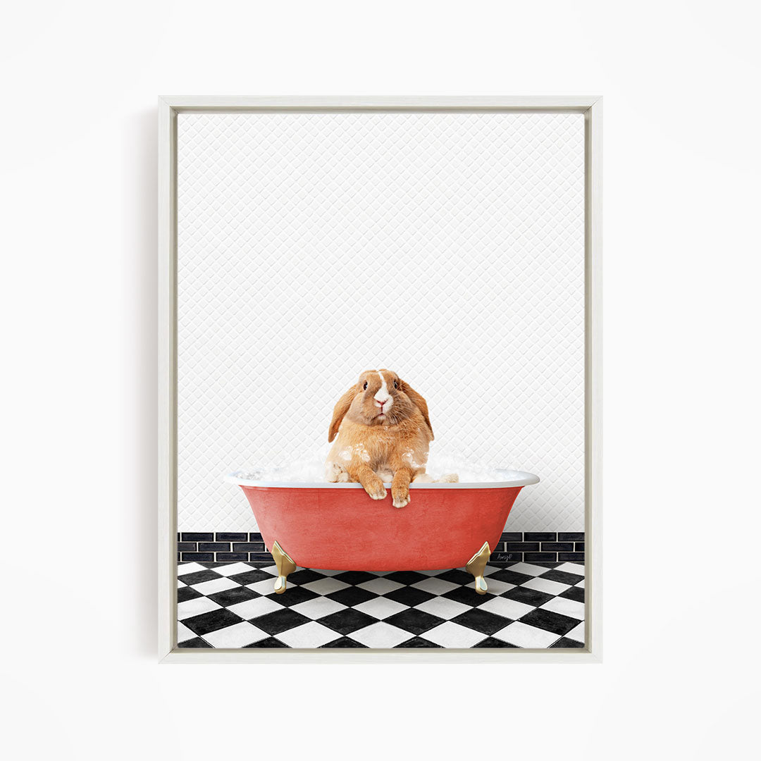 A brown rabbit sitting in a red bathtub filled with bubbles, surrounded by a black and white checkered floor.