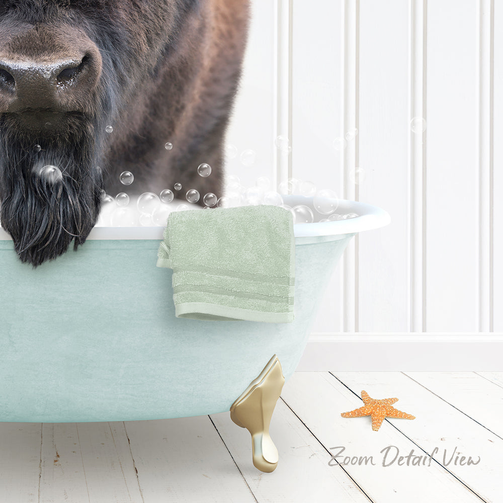 A dog is standing in a bathtub filled with bubbles, with a towel and starfish nearby.