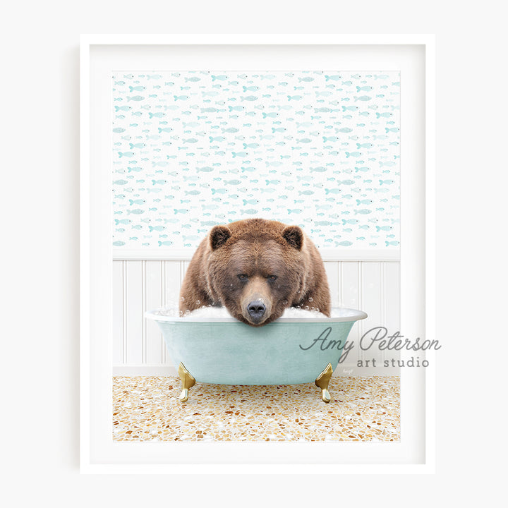 a brown bear sitting in a blue bath tub