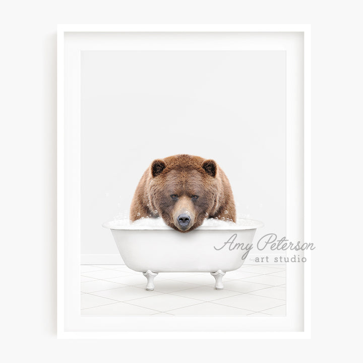 a brown bear sitting in a bath tub