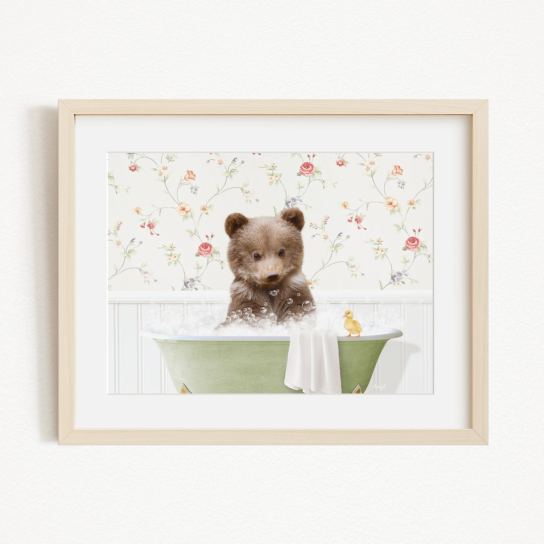 A brown bear sitting in a green bathtub filled with bubbles, with a yellow rubber duck floating nearby.