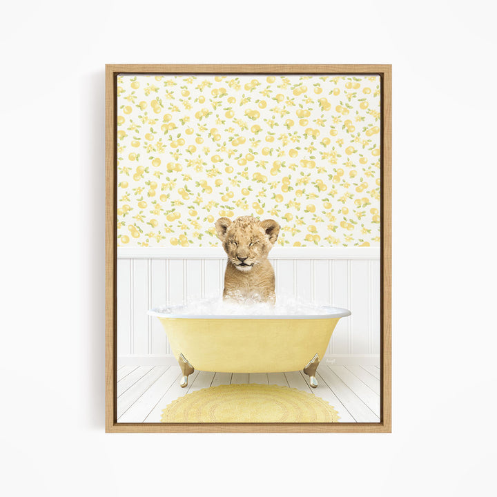 A young lion cub sitting in a yellow bathtub filled with water, surrounded by a yellow floral wallpaper.
