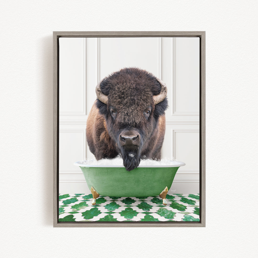 A bison with a long beard is standing in a green bathtub, with a patterned green and white rug on the floor beneath it.