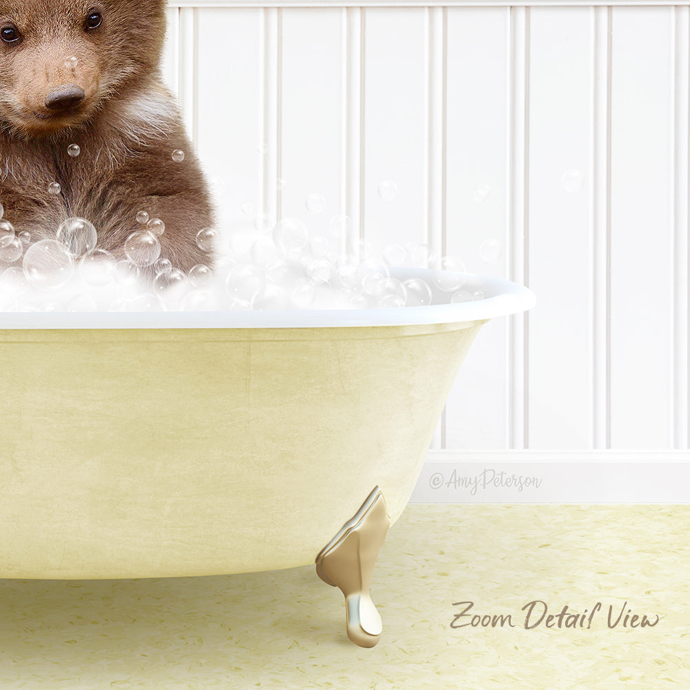 A cute brown bear sitting in a bathtub filled with bubbles, with a white wall in the background.