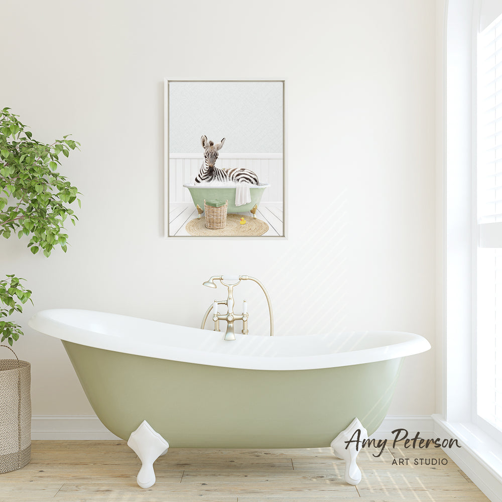 A green clawfoot bathtub with a zebra sitting in it, as depicted in a framed artwork on the wall.