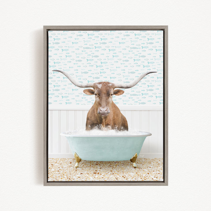 A brown steer with large curved horns is sitting in a light blue bathtub filled with bubbles, creating a whimsical and playful scene.