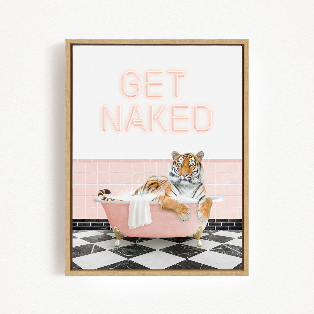 A framed print featuring a tiger sitting in a pink bathtub with the text "GET NAKED" displayed above it.