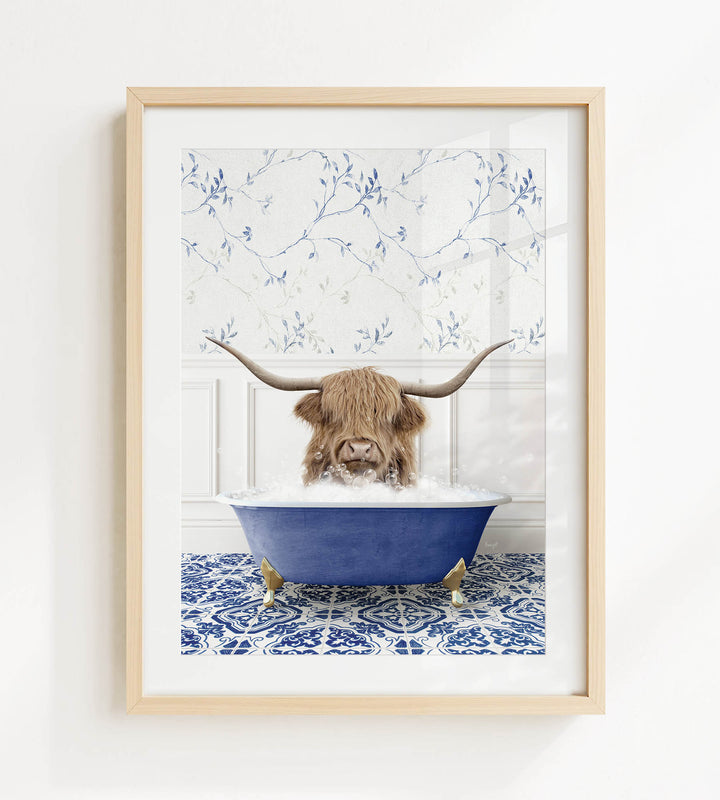 A brown cow with long horns is sitting in a blue bathtub filled with water, surrounded by a blue and white patterned floor.