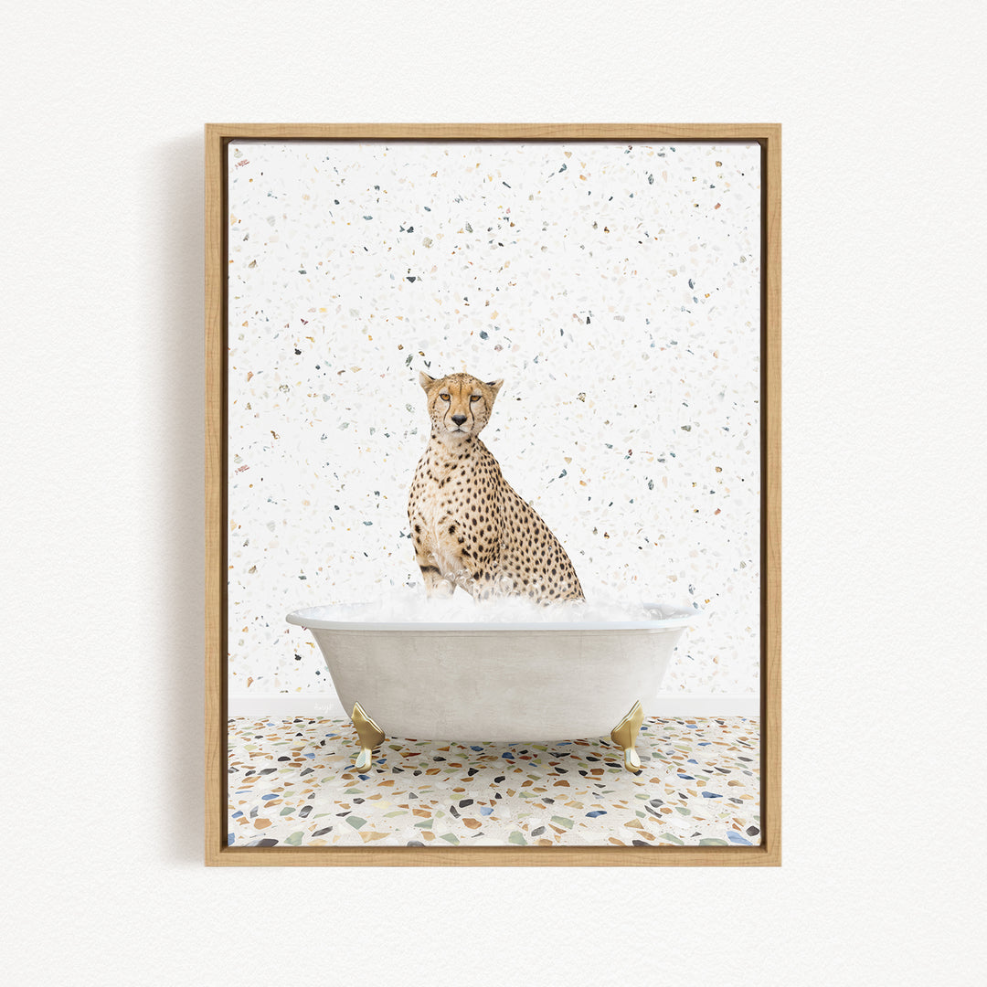 A cheetah sitting in a white bathtub filled with water, surrounded by a speckled pattern on the floor.