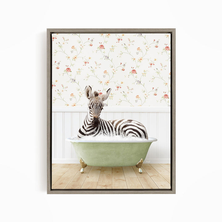 A zebra is sitting in a green bathtub, surrounded by a floral wallpaper.