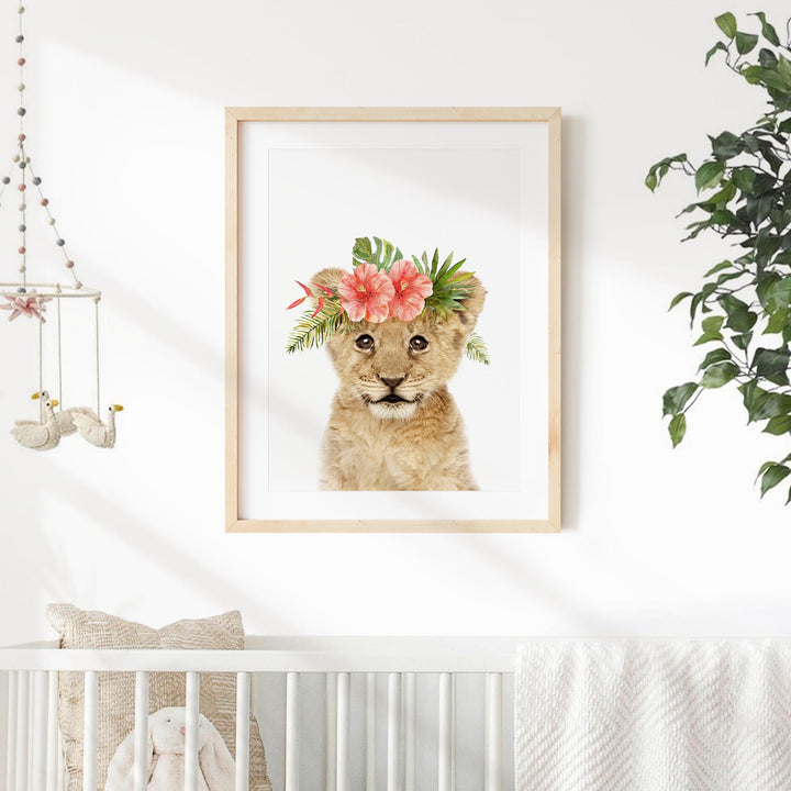 a picture of a lion cub with a flower crown on its head