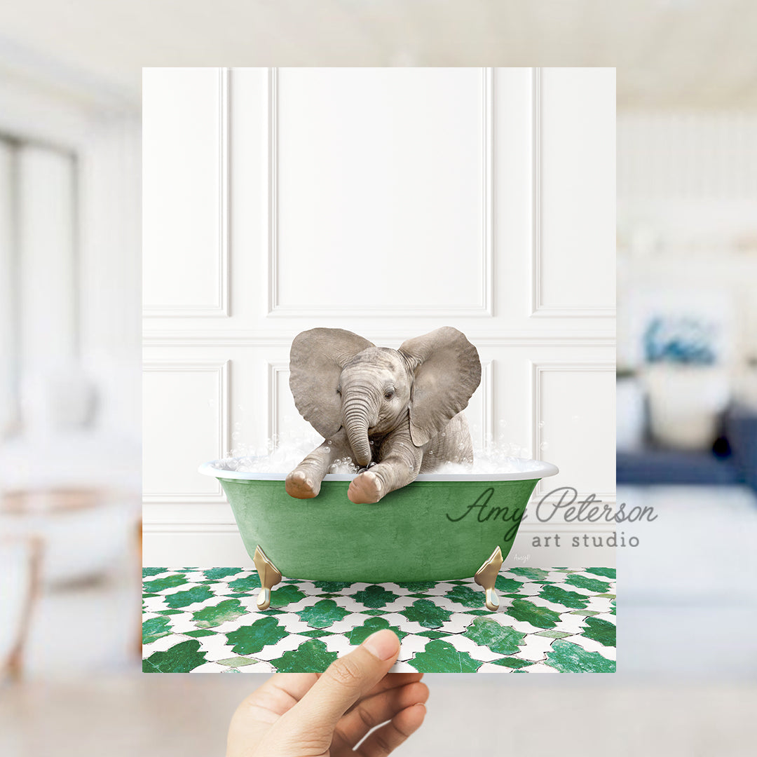 a person holding up a card with an elephant in a bathtub