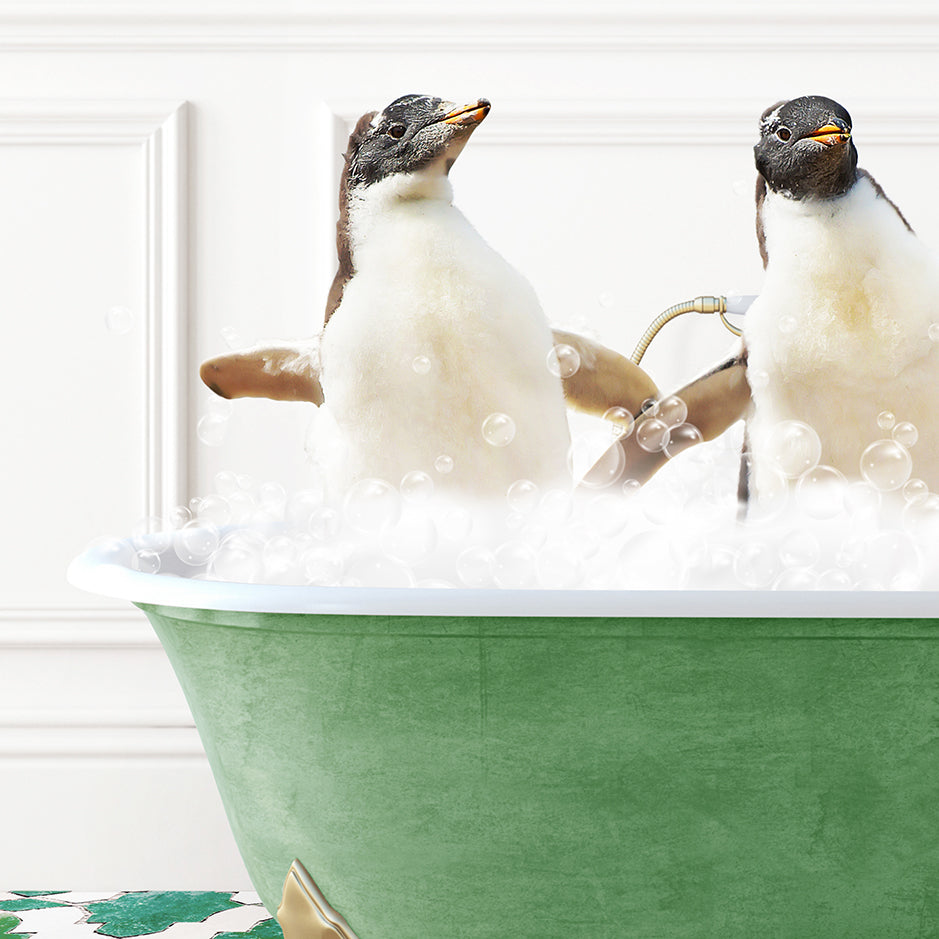 two penguins sitting in a bathtub full of bubbles