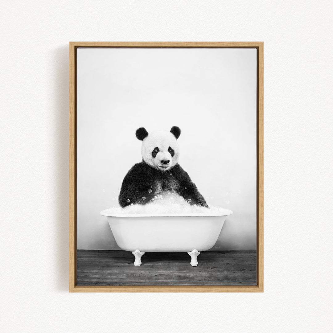 A panda bear sitting in a white bathtub filled with bubbles, creating a whimsical and playful scene.