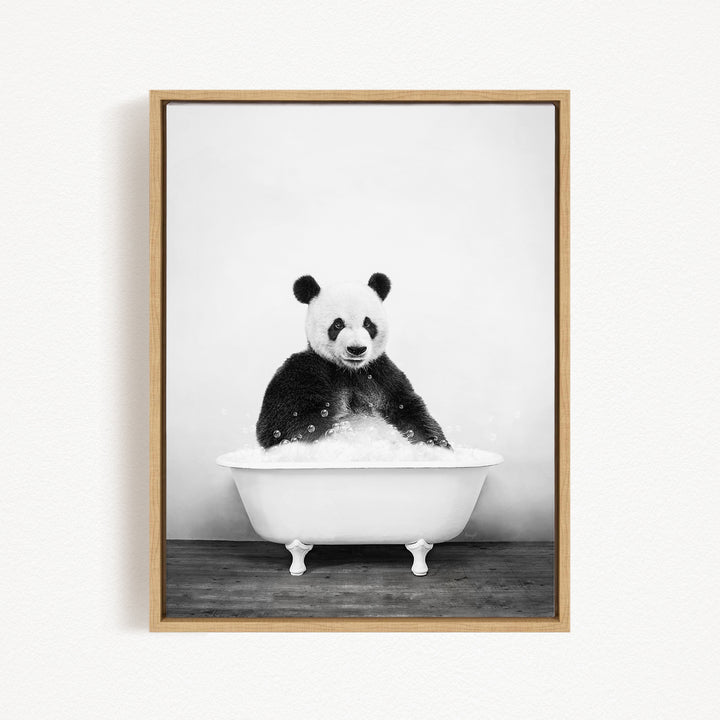 A panda bear sitting in a white bathtub filled with bubbles, creating a whimsical and playful scene.