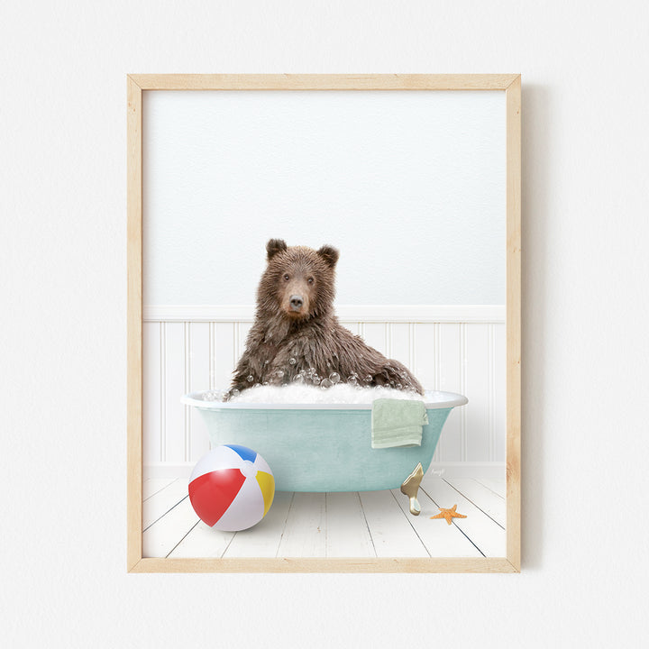 a picture of a bear in a bathtub with a beach ball