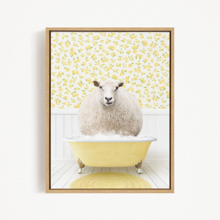 A fluffy white sheep sits in a yellow bathtub filled with bubbles, surrounded by a yellow floral pattern on the wall behind it.