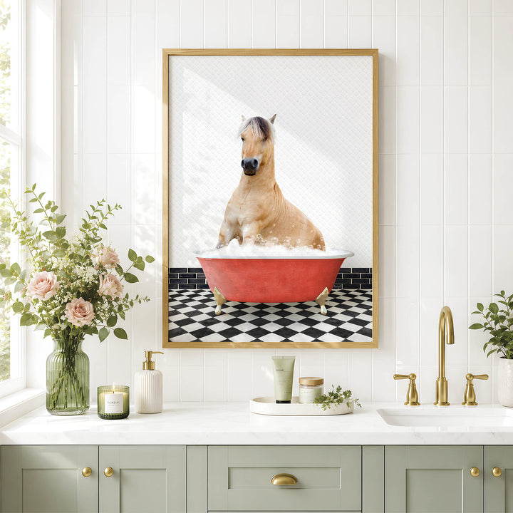a horse sitting in a red bathtub, surrounded by a black and white checkered floor and a framed picture of the horse.