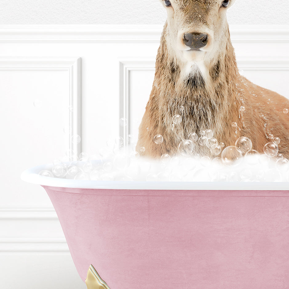 a deer is sitting in a bathtub with bubbles