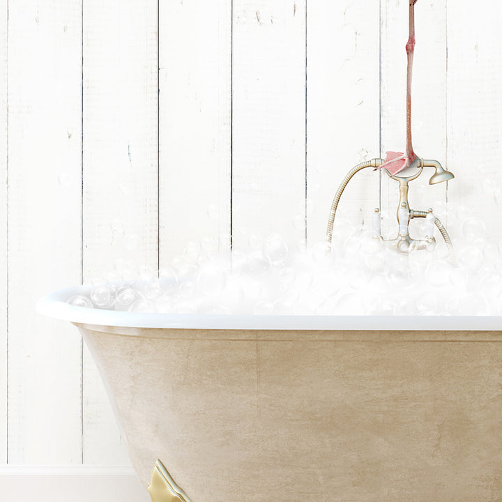 a bathtub filled with foam and a faucet