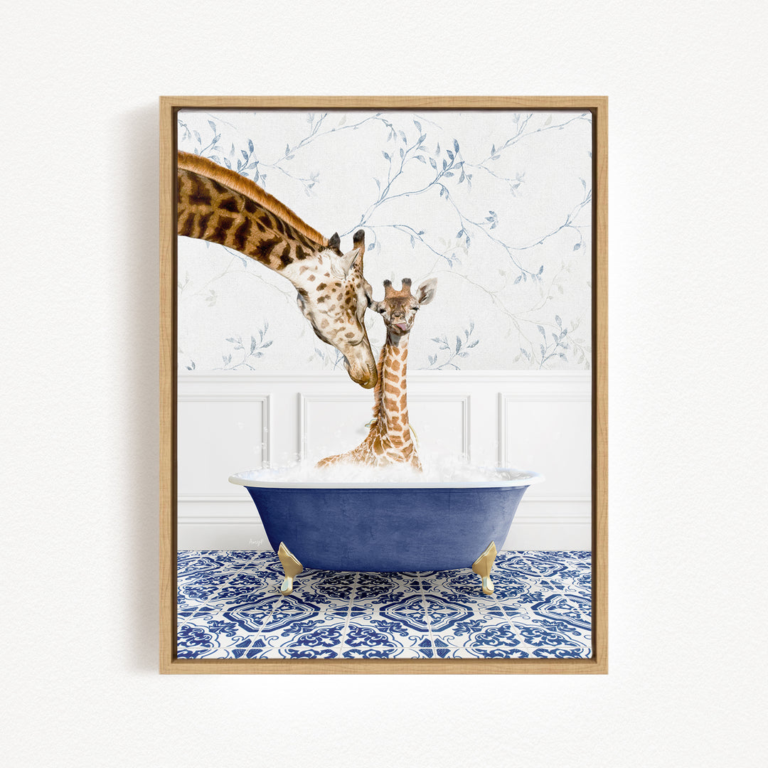 A mother giraffe and her baby giraffe are sitting together in a blue bathtub, with the mother gently licking her baby.