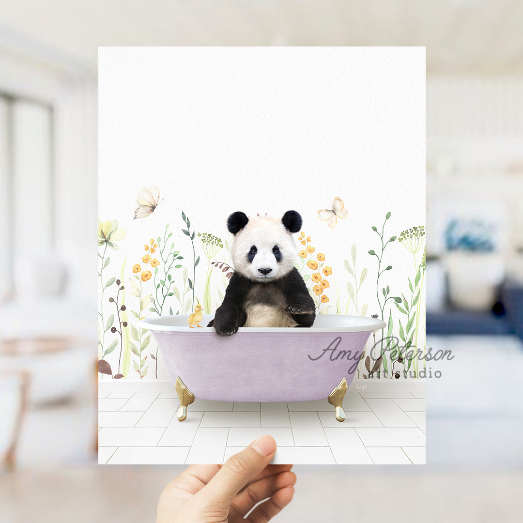 a hand holding a card with a panda bear in a bathtub