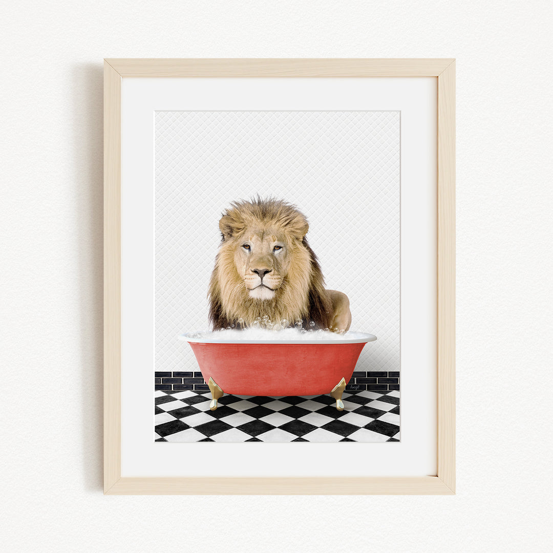 A lion sitting in a red bathtub on a black and white checkered floor.