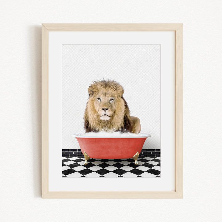 A lion sitting in a red bathtub on a black and white checkered floor.