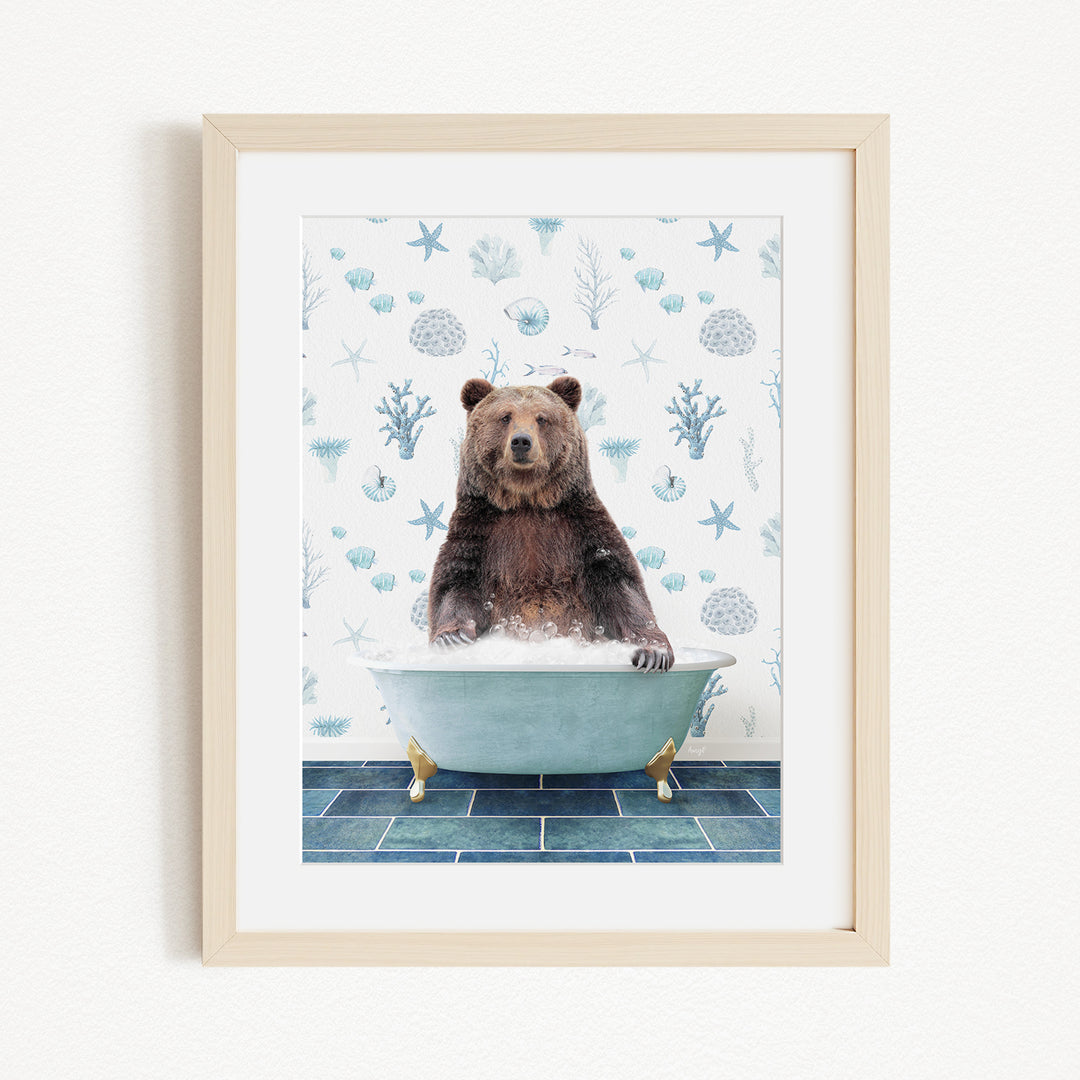A brown bear sitting in a bathtub filled with bubbles, surrounded by a blue and white patterned wall.