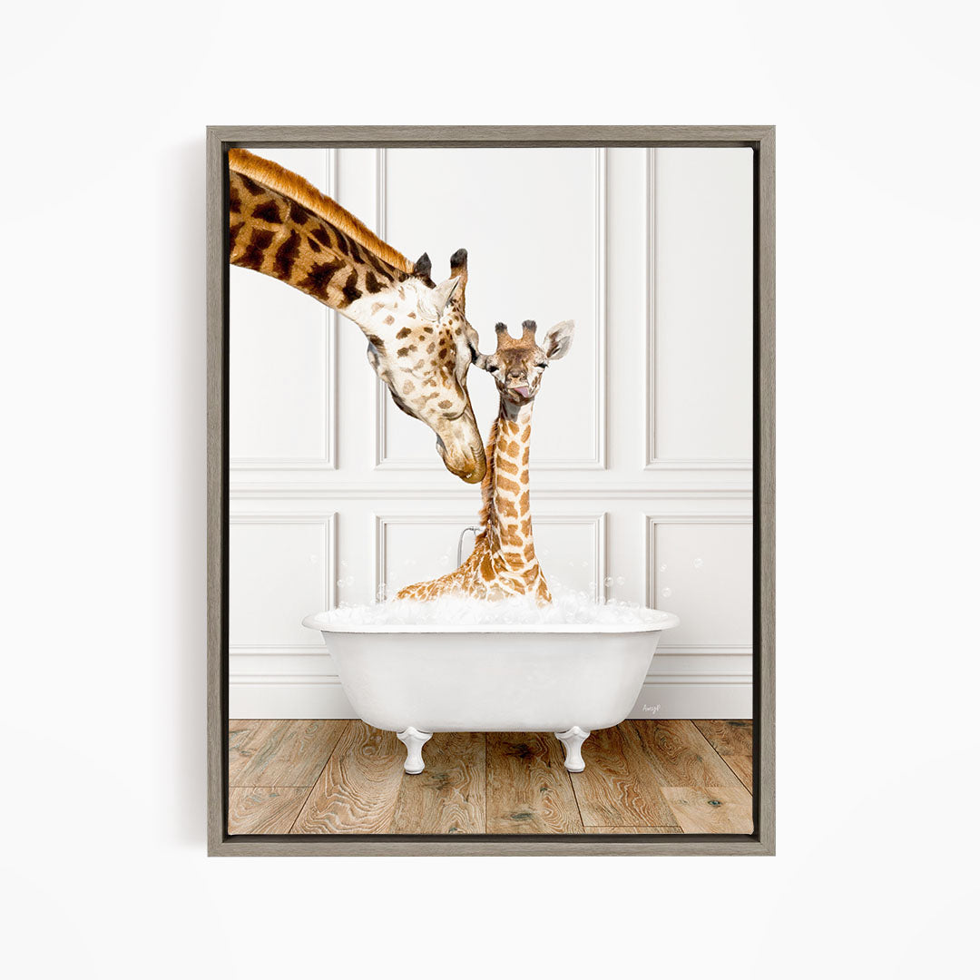 A mother giraffe and her baby giraffe enjoying a bath together in a white bathtub against a white wall.