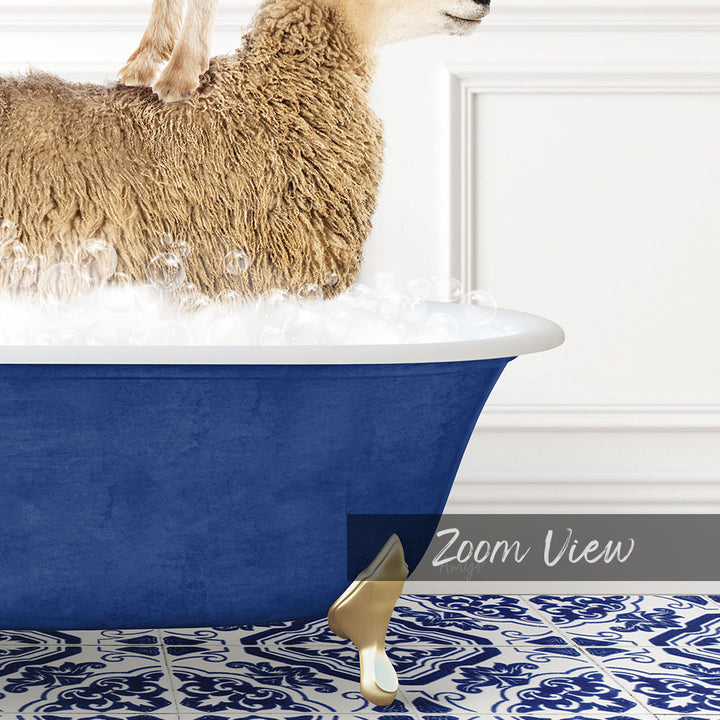 A fluffy brown sheep is standing in a blue bathtub filled with bubbles, with a gold bathtub spout visible.
