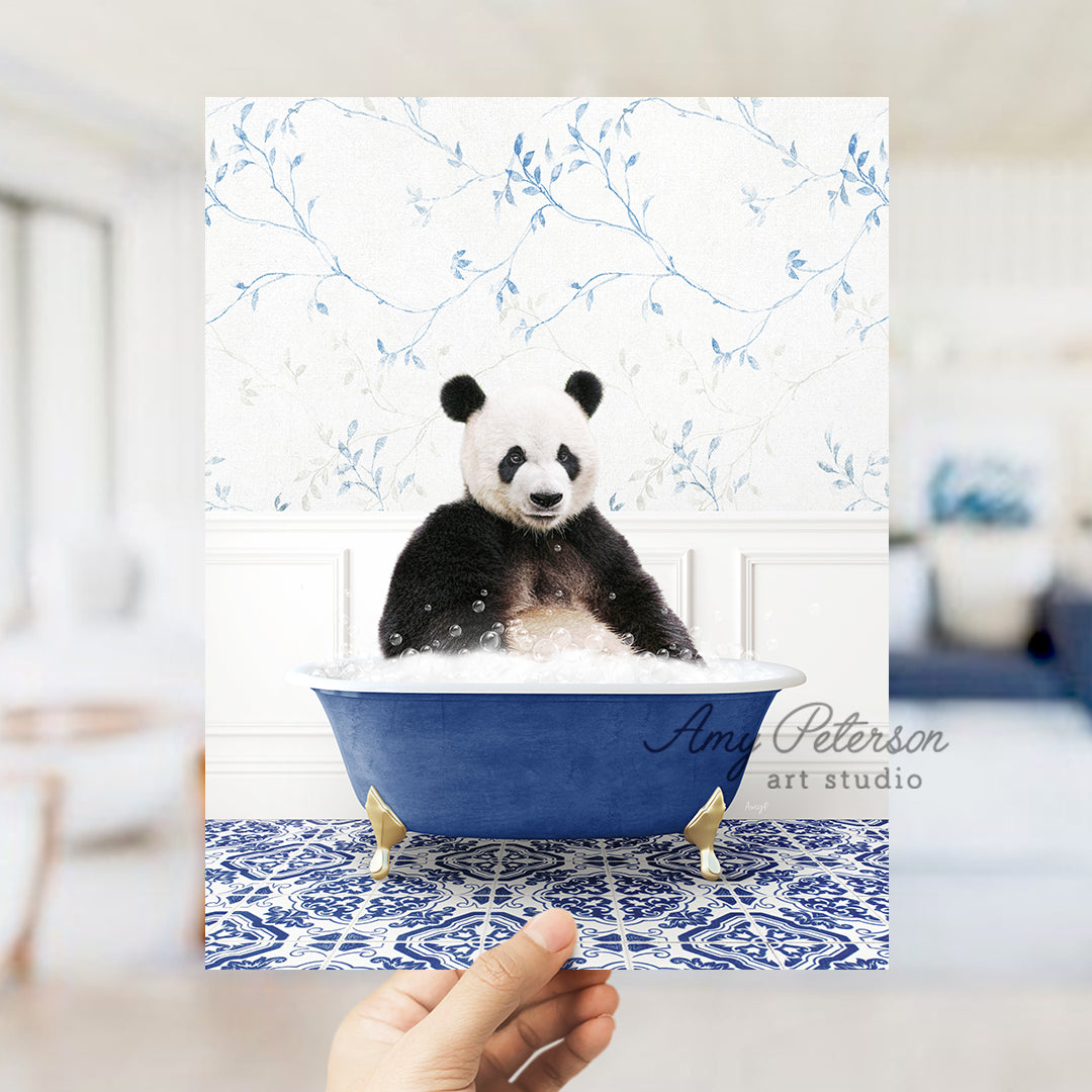 a hand holding a card with a panda in a bathtub