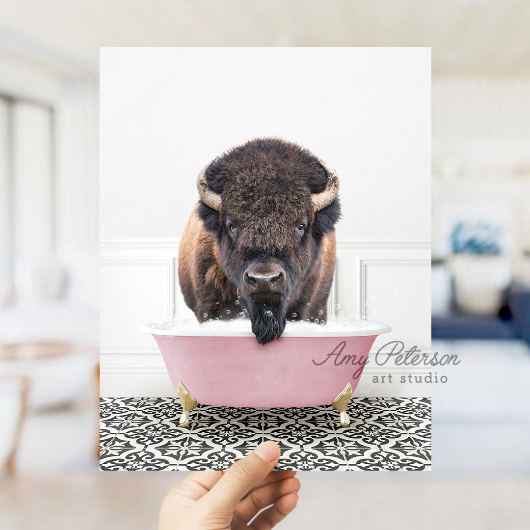 a person holding a card with a picture of a bison in a bathtub