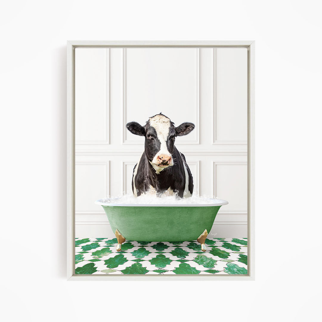 A black and white cow standing in a green bathtub filled with water, with a green and white patterned floor beneath it.